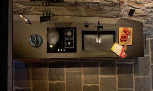 an overhead view of a kitchen with a sink at Buron du Tournel, un écrin d'exception in Le Lioran +22 photos