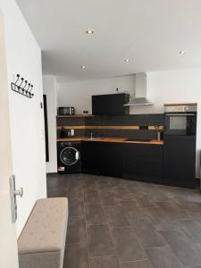 a kitchen with a washer and dryer in it at RS home CB 1 in Cottbus