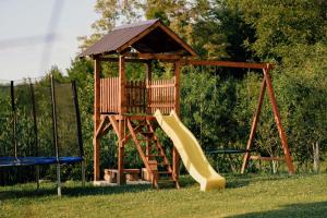 a playground with a slide and a gazebo at Kuca za odmor Lovric in Verija