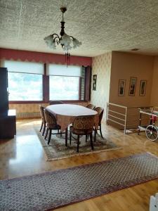 a dining room with a table and chairs at Guest room in Retro House in Turku +7 photos