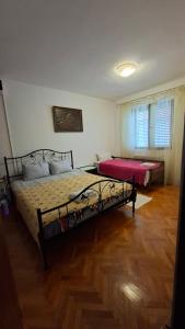 a bedroom with two beds in a room at Natalia Rooms Old Town in Herceg-Novi