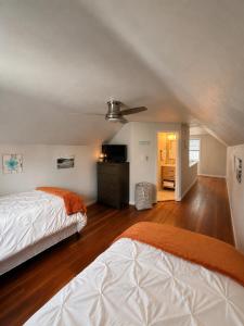 a bedroom with two beds and a ceiling at Serenity Landing in Sioux Falls