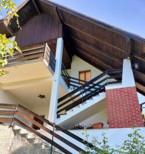 a house with stairs leading up to it at Casa Silva in Pieve Tesino