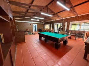 a large room with a pool table in it at Sítio São Roque in São Roque