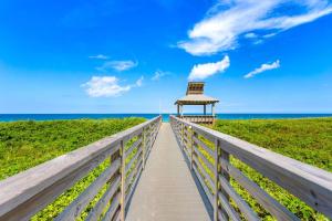 a boardwalk to the beach with a gazebo at C308B - Duck Tails in Duck