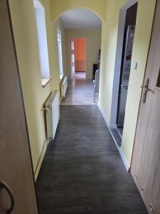 a hallway of an office building with a long hallway at Apartament Górna in Głuszyca
