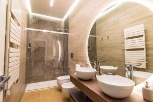 a bathroom with two sinks and a shower at Live in Gaeta in Gaeta