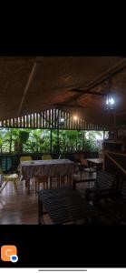a restaurant with a table and chairs and lights at KARTSIVADZe in Ureki +43 photos