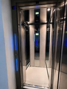 an empty elevator in a building with its door open at SkyVista Villa in Iraklitsa