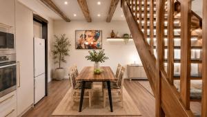 a kitchen and dining room with a table and chairs at Apartment in Žatec in Žatec