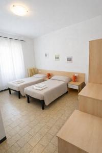 a room with two beds in a room at Hotel Degli Angeli in Pontinvrea +9 photos