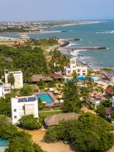 an aerial view of a resort and the ocean at The C Resort & Residences in Prampram