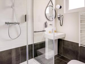 a bathroom with a shower and a sink at ibis Daumesnil Porte Doree in Paris +33 photos