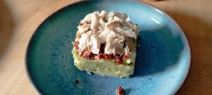 a piece of cake on a blue plate on a table at Chambres d'hôtes Las Carbounieros in Auriac +25 photos