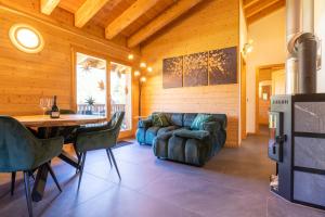 a living room with a couch and a table at Ferienwohnung Aegimatte in Ulrichen