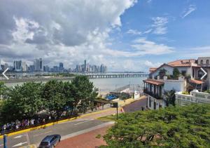 a view of a city with a bridge in the background at Hostel Museo Relic in Panama City