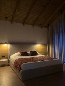 a bedroom with a large bed with two pillows at escape gabala in Vǝndam +16 photos
