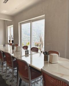 a conference room with a long table and chairs at Ramasa Lake House in Bhīm Tāl