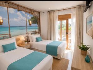 a bedroom with two beds and a view of the ocean at Oliver Santiago Mallorca in Cala Figuera