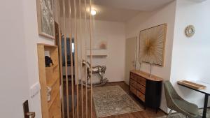 a bathroom with a shower and a desk and a sink at Kolonáda in Poděbrady