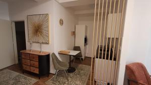 a room with a desk and a chair and a table at Kolonáda in Poděbrady