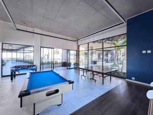 a large room with a pool table in it at Shoreline Sanctuary! in Ballito +13 photos