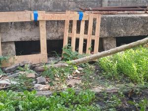 a pile of wood in front of a building at KUNGHORk in Ban Nong Chaeng