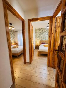 a hallway with two beds in a room at Casa Lulù in Cala Gonone
