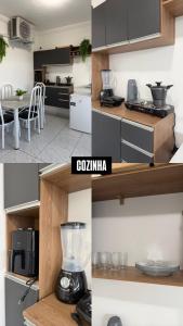 a kitchen with a blender on top of a counter at Estadia rápida- Quarto 3 in Bayeux