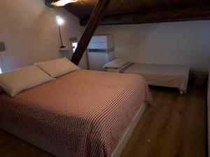 a room with two beds in a room at La Clarita in Vittorio Veneto +3 photos
