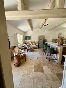 a large living room with chairs and a table at BERGERIE A Murta, Domaine de l Ogliastru in Olmeto