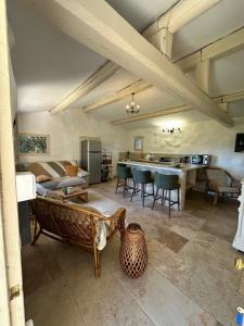 a living room with a couch and a table at BERGERIE A Murta, Domaine de l Ogliastru in Olmeto +9 photos