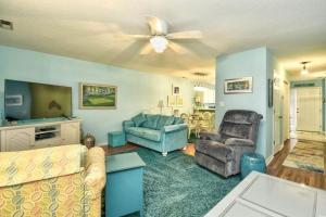 a living room with a couch and a ceiling fan at Nice N Myrtle beach house in Little River +34 photos
