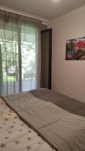 a bedroom with a large bed with stars on it at STEPANAVAN guesthouse in Stepʼanavan
