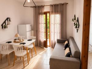 a living room with a couch and a table at Villa Evgenia(Leonidas) in Ierissos