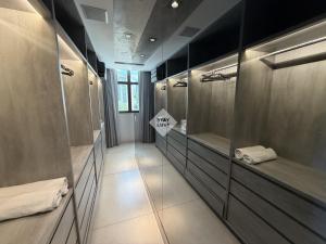 a large bathroom with two sinks and mirrors at Ville Celestine Condo Hotel 704 in Belo Horizonte