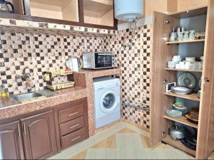 a kitchen with a washer and a washing machine at Oasis Menara in Marrakesh