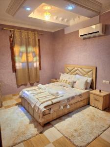 a bedroom with a large bed in a room at Oasis Menara in Marrakesh