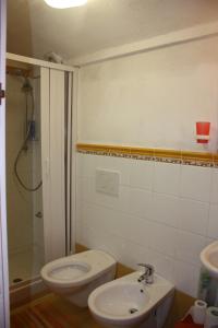 a bathroom with a sink and a toilet and a shower at Casa Reginella - Borgo Marinaro in Conca dei Marini +62 photos