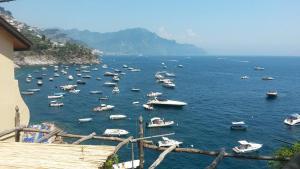 a large group of boats in the water at Casa Reginella - Borgo Marinaro in Conca dei Marini