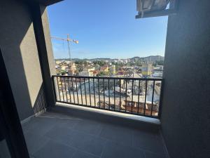 a balcony with a view of a city at Dio East Apartments in Tirana