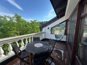 a balcony with a table and chairs on it at Honor-Penthouse in Linz
