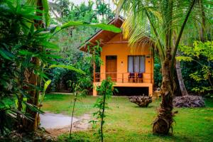 a small house in the middle of a forest at Walawa Wild Place in Udawalawe