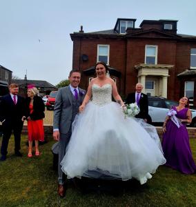 a man and a woman in a wedding dress at Ta'Pinu House and Spa in Horse Isle