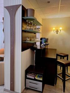 a kitchen with a counter and a table in a room at Hotel mit zwei doppelzimmer in Leipzig