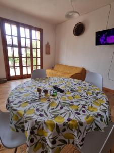 a room with a table with a flowered table cloth on it at Villa Costa Paradiso del Sud in Costa Rei
