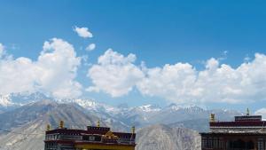 a view of a mountain range with snow covered mountains at Moon Lake Hotel, Nako in Nako