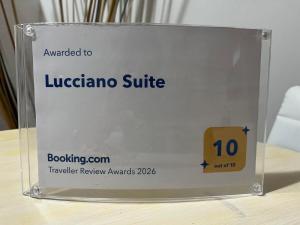 a sign that says lucadia suite on a table at Lucciano Suite in Quarrata