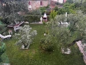an aerial view of a garden with trees and a house at Lucciano Suite in Quarrata
