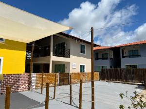 a building with a fence in front of it at El Shaday Suítes - ATÍNS in Atins +7 photos